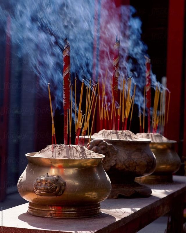 Incense burning before a temple altar