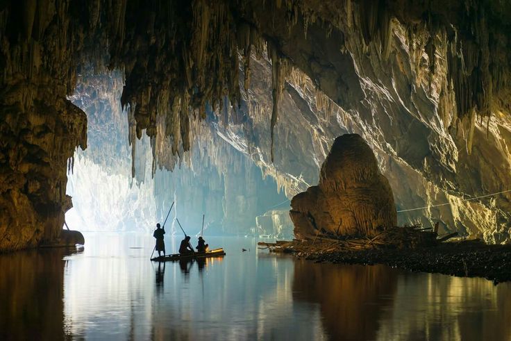 A boat drifting through an underground river cave