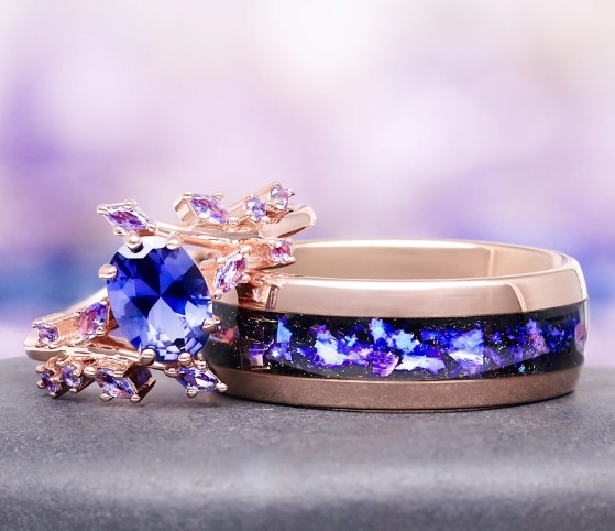A pair of gold wedding rings, one set with a diamond
